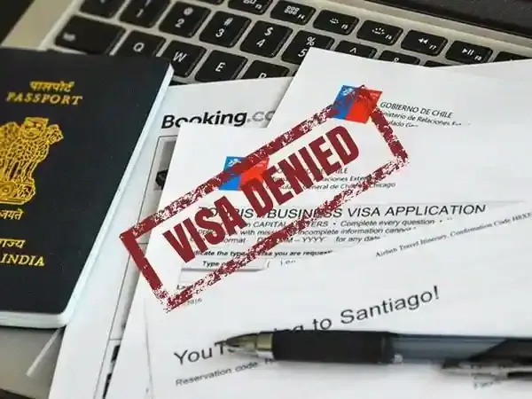 A visa application stamped "visa denied"